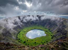 Scenic travel guide view of wildlife and caldera landscapes during a game drive in Ngorongoro Crater